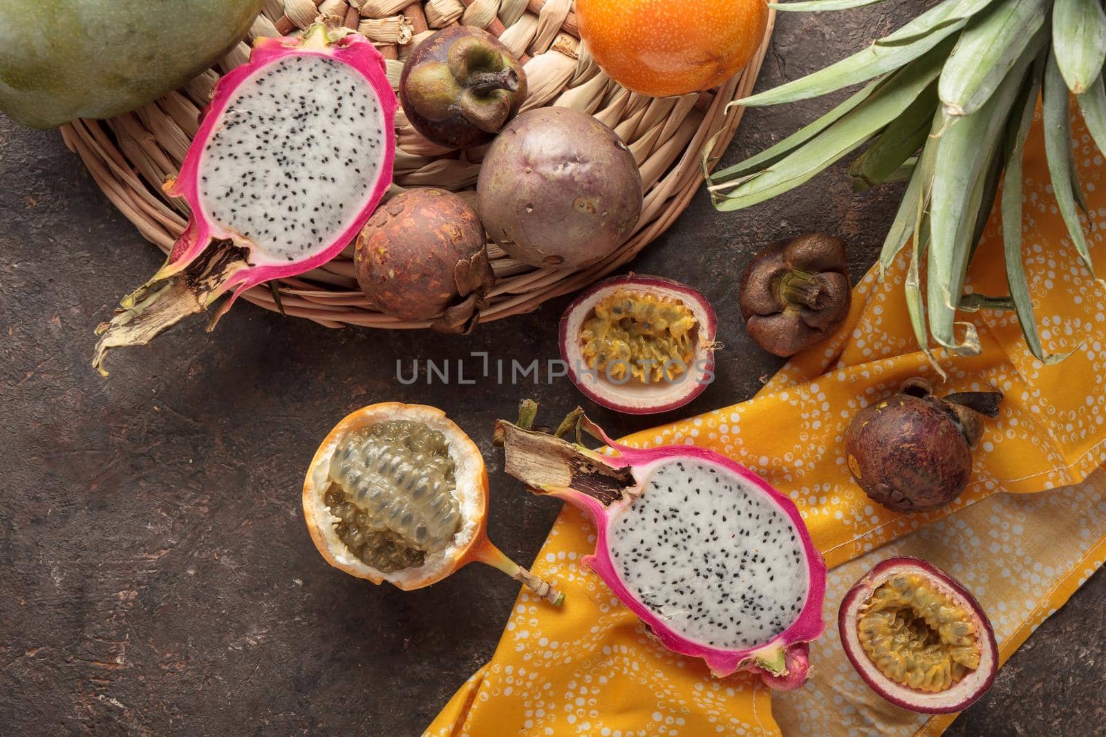 Tropical fruits on a dark background table