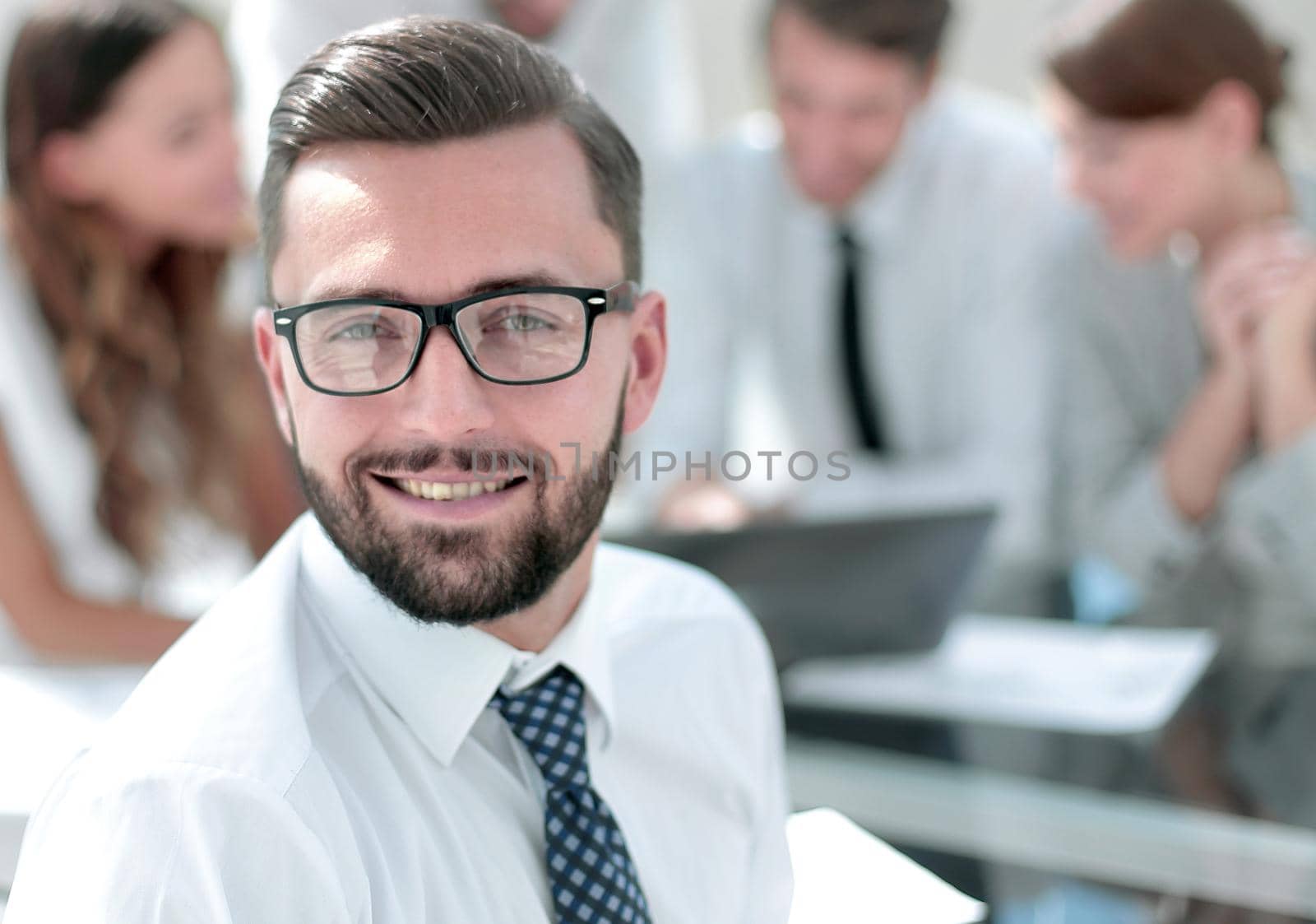 businessman in front of his business team by asdf