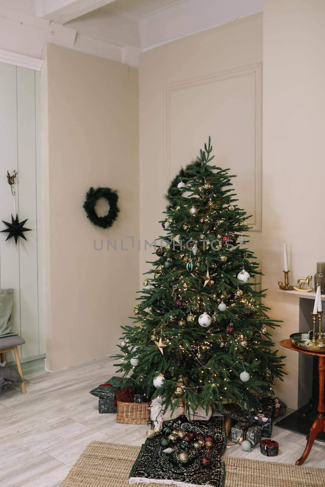 Stylish Christmas interior decorated in rustic style. Handmade festive decorations. Home family comfort. High quality photo