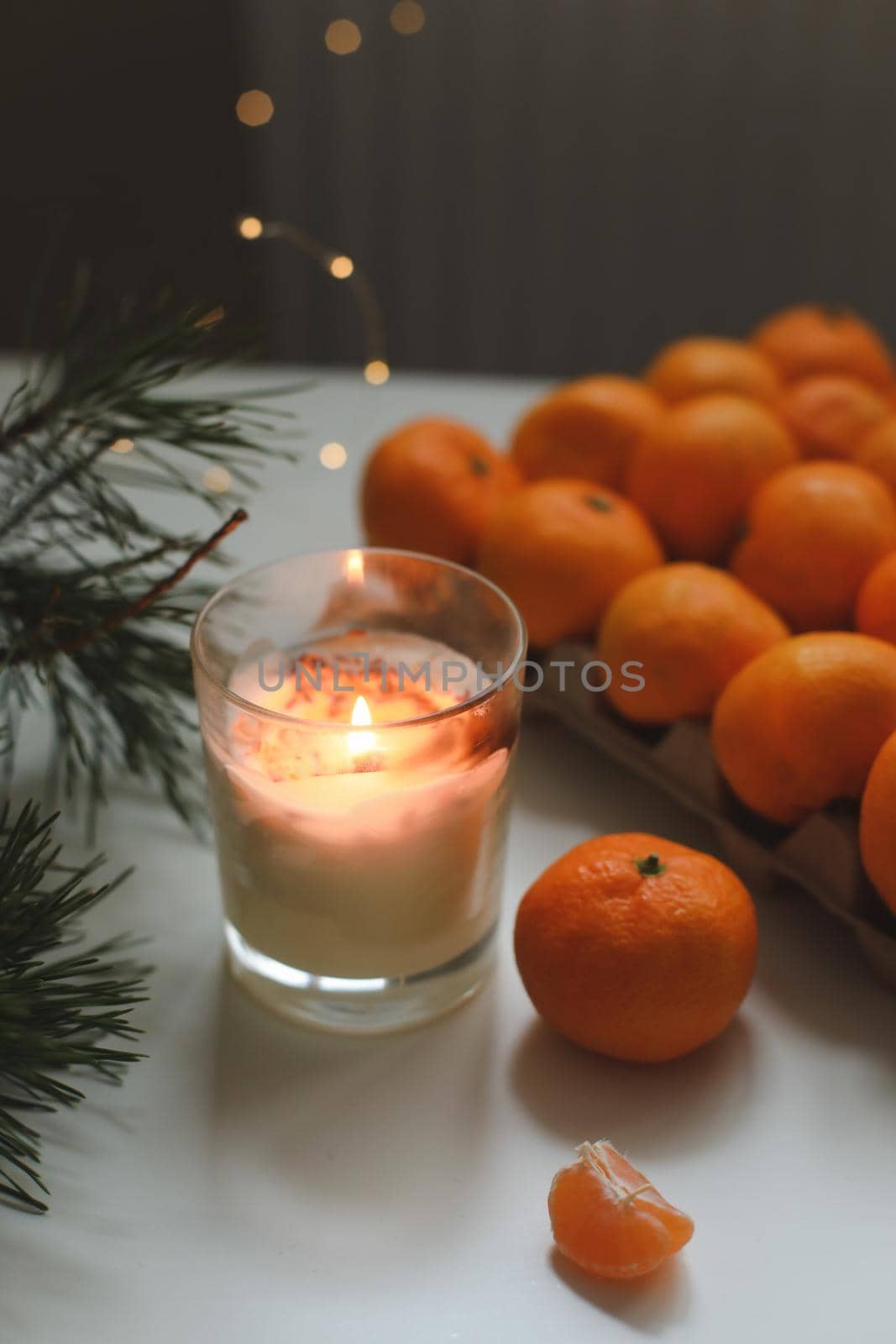 Christmas background with fir tree branches and tangerines. Merry Christmas and Happy New Year Greeting Card. Copy space. Top view. High quality photo