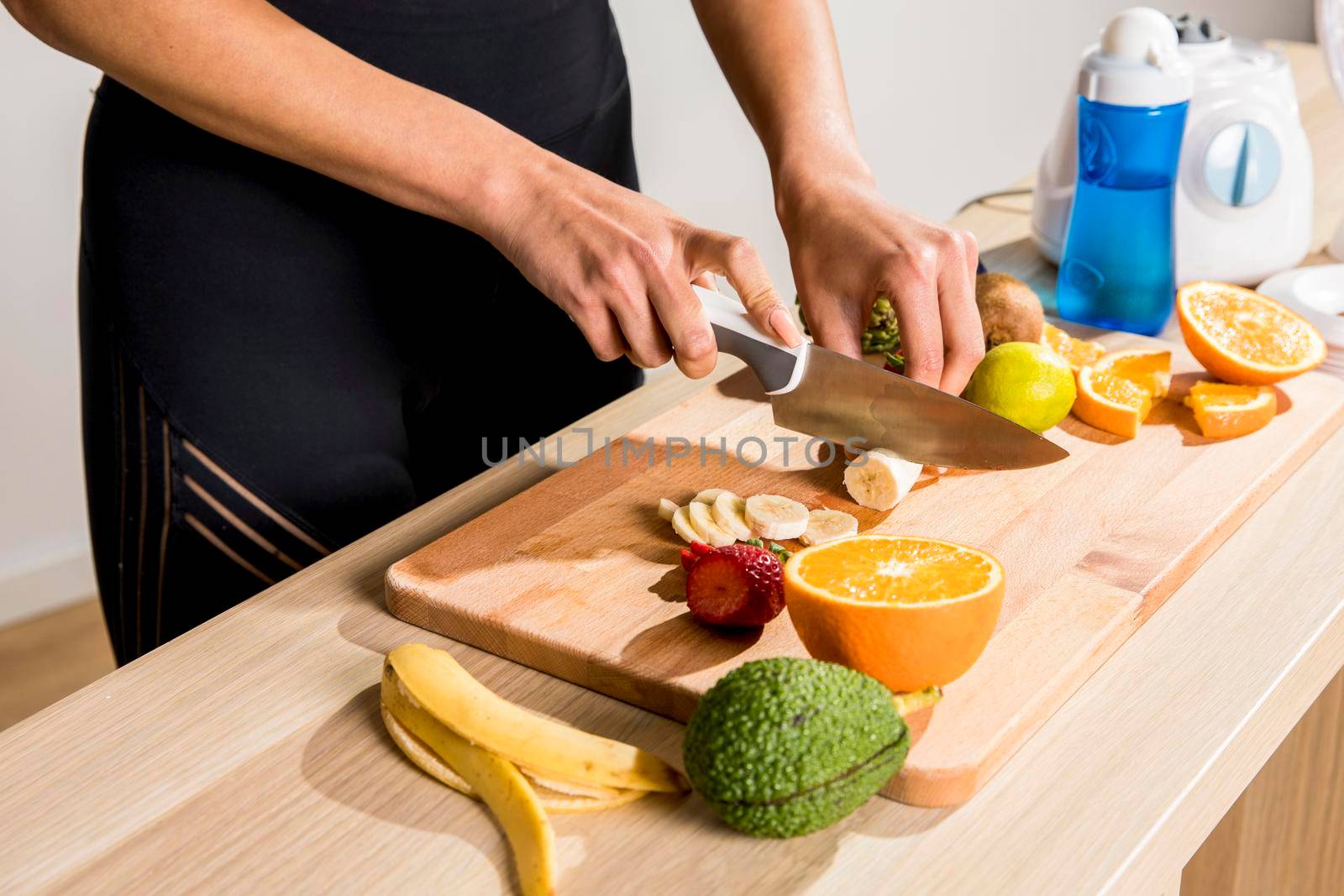 fitness woman preparing detox juice by Zahard