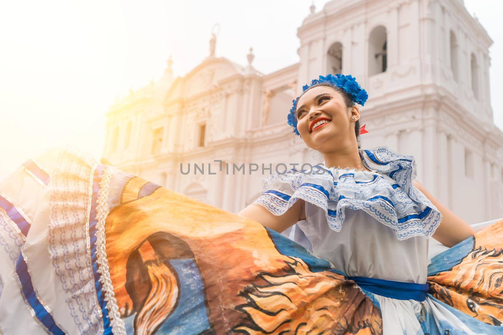 Traditional dancer with a typical Nicaraguan costume dancing outside the cathedral of Leon Nicaragua celebrating the Central America independence festivities.