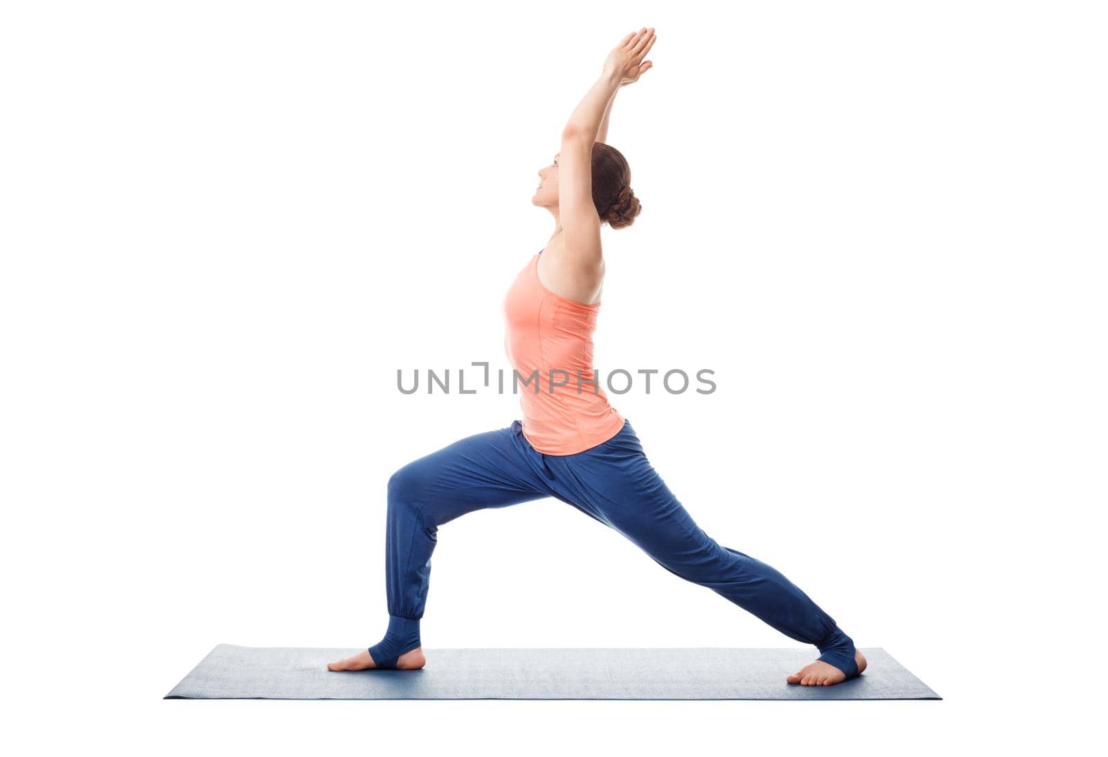 Woman practices yoga Warrior asana by dimol