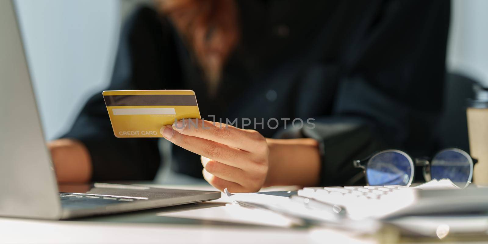 Woman using online payment and holding credit card. Online Shopping concept