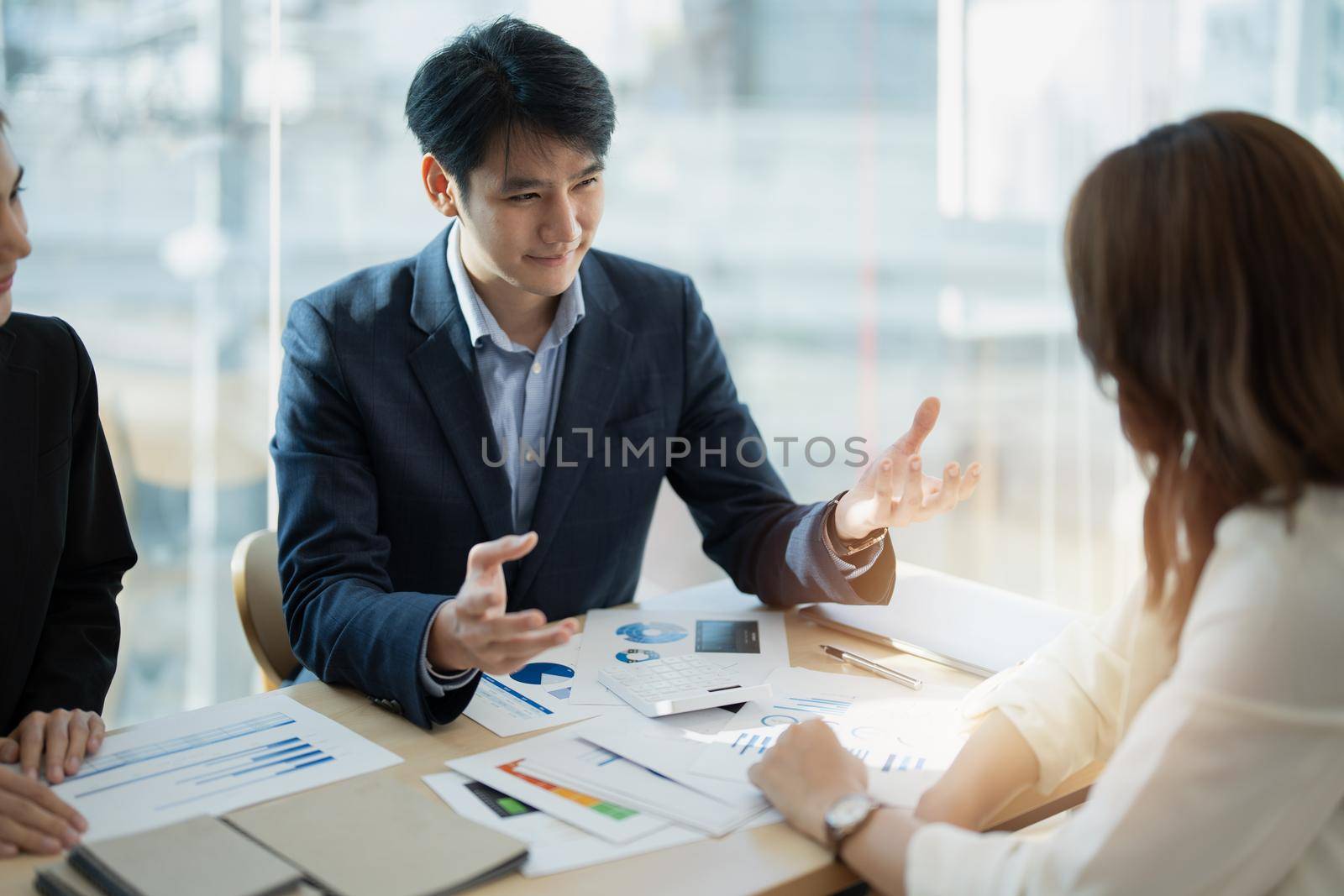 Business People Meeting to analyse and discuss and brainstorming the financial report chart data in office Financial advisor teamwork and accounting concept.