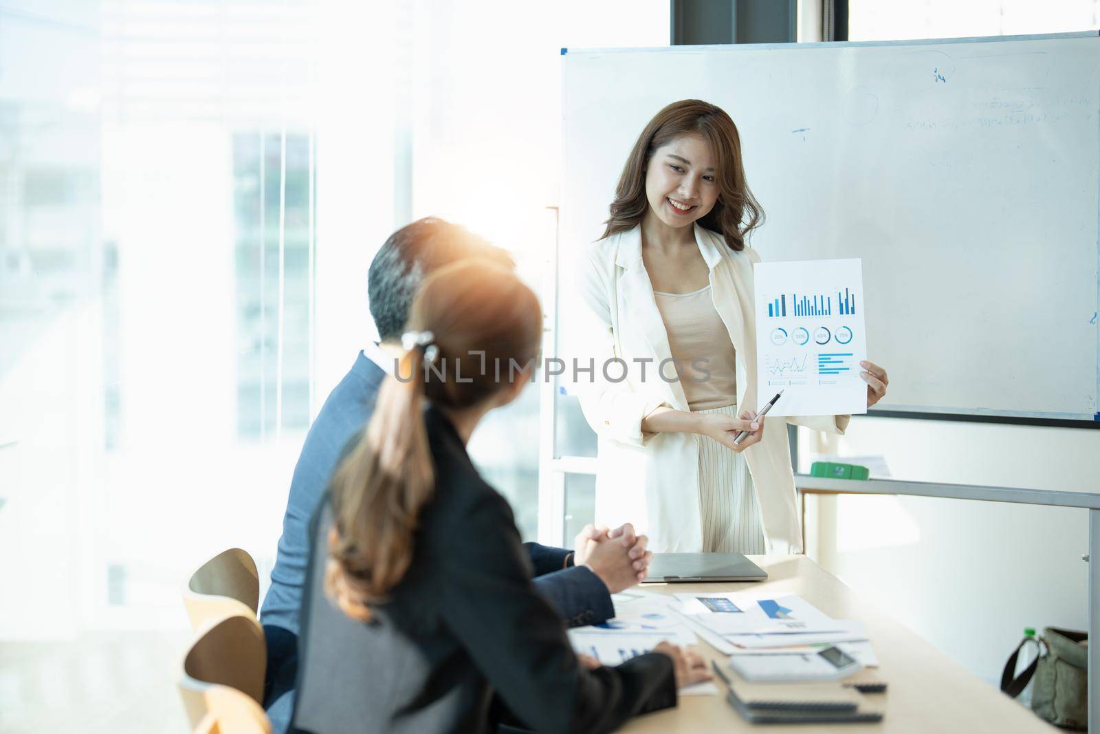 Asian business adviser meeting to analyze and discuss the situation on the financial report in the meeting room.Investment Consultant, Financial advisor and accounting concept