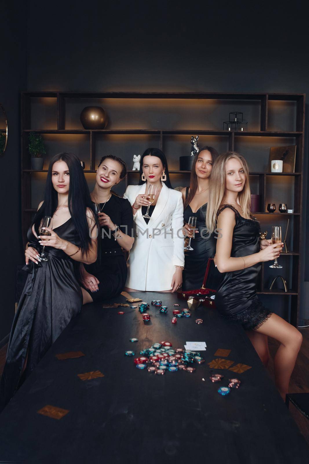 Gorgeous sexy ladies at poker table with drinks. by StudioLucky