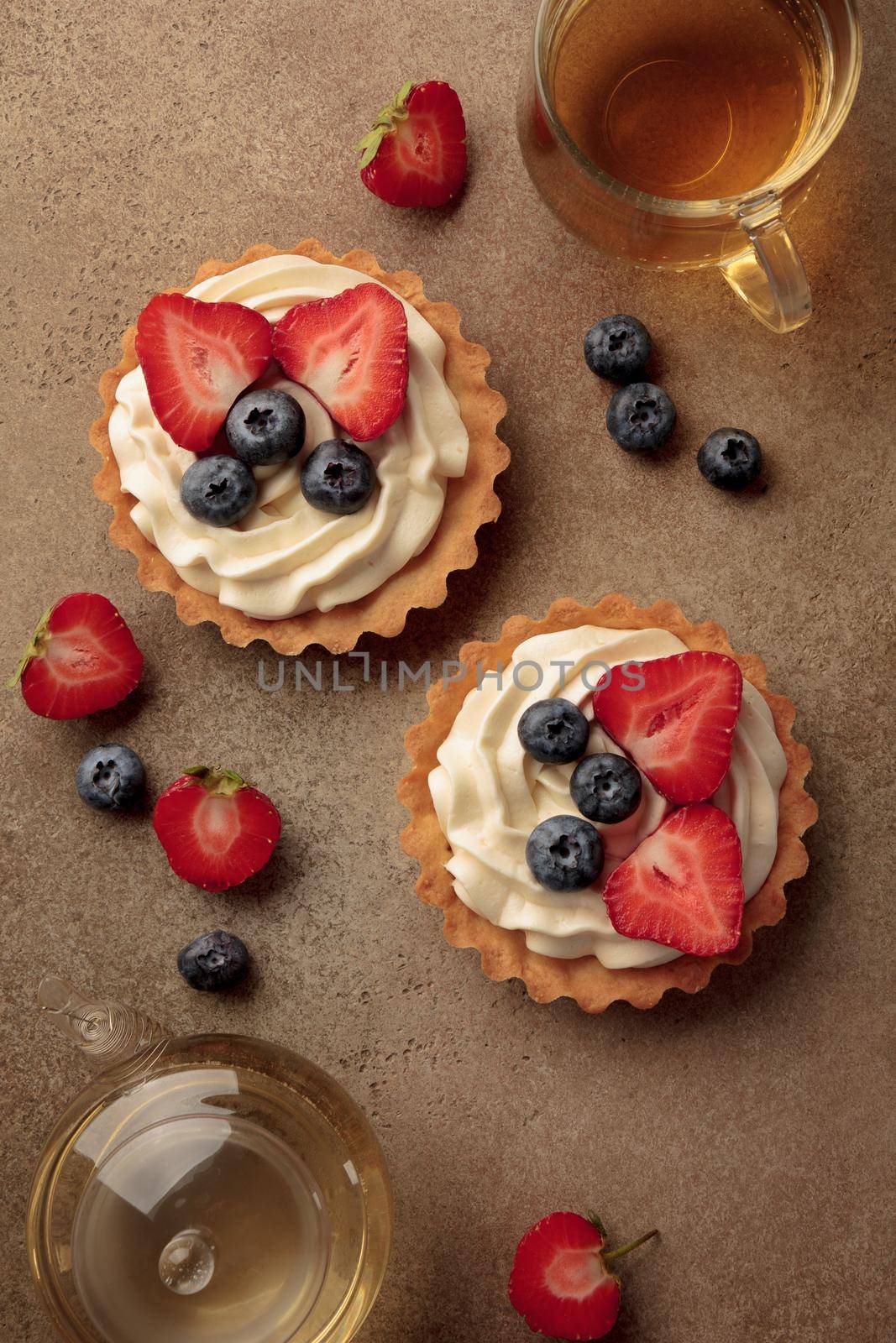 Mini tart with cream cheese and berries top view