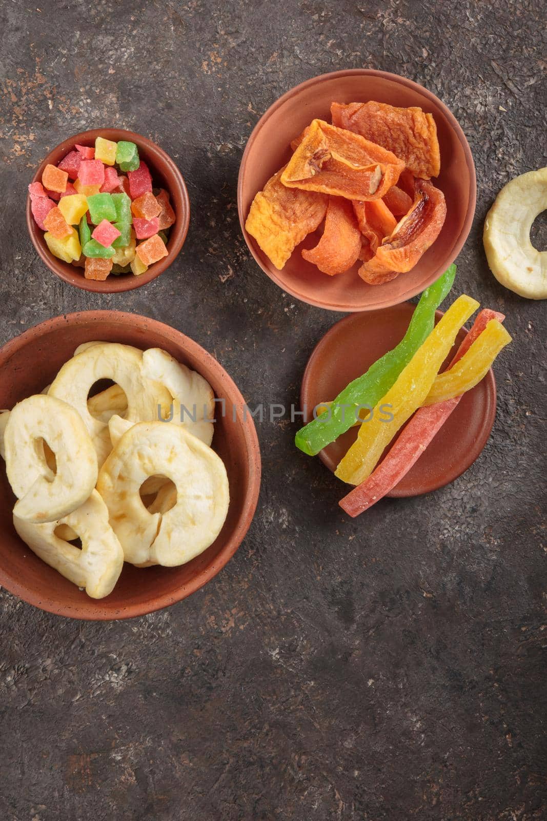 Dried Sweet Fruits on a dark brown background