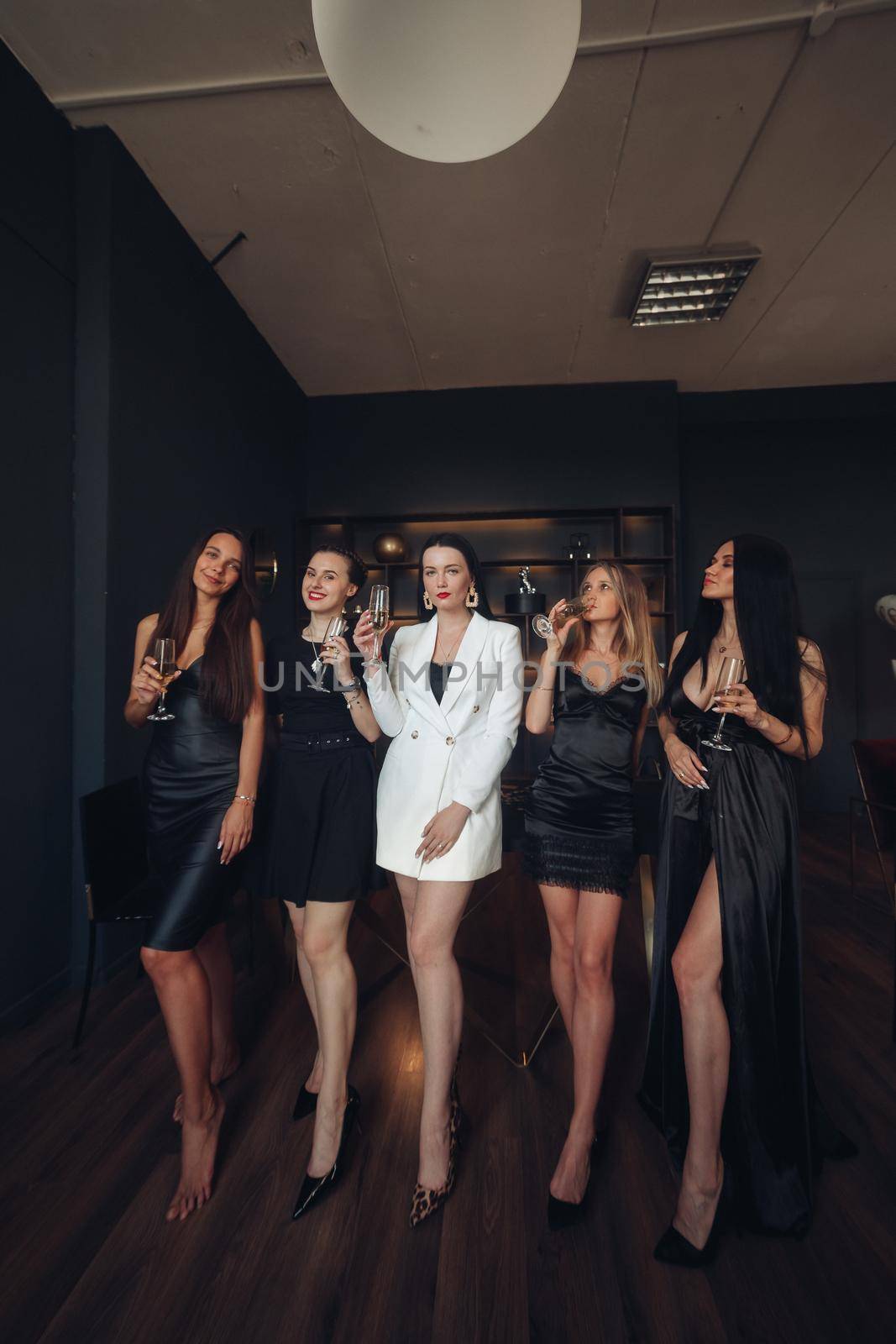 Happy beautiful women posing in luxury interior by StudioLucky