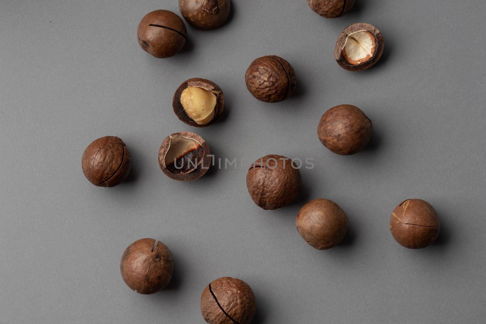 Macadamia nuts on a grey background top view
