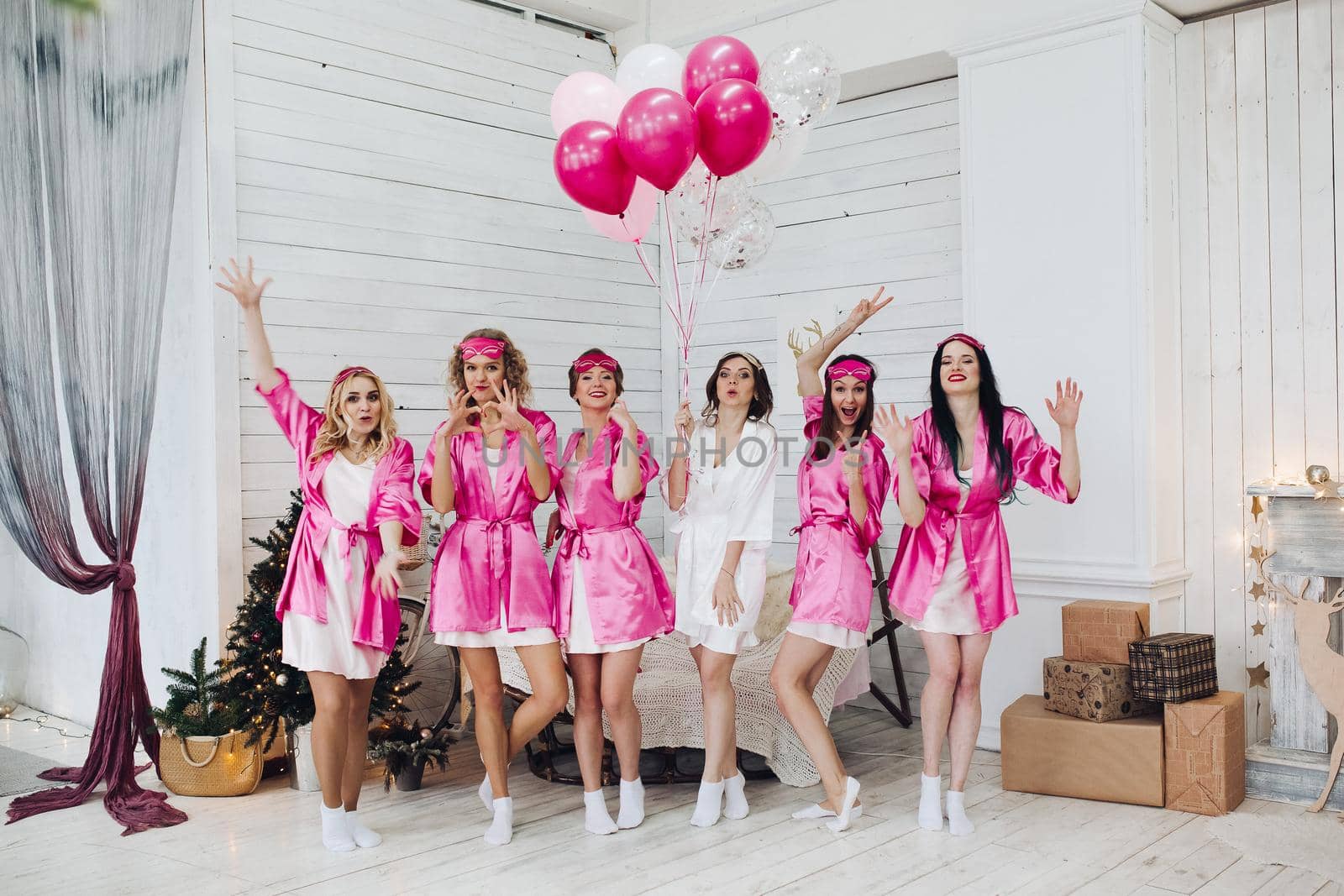 Bridesmaids and bride having fun at bachelorette party. by StudioLucky