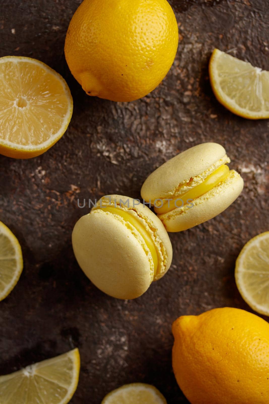 Lemon macaroons on a dark background macro