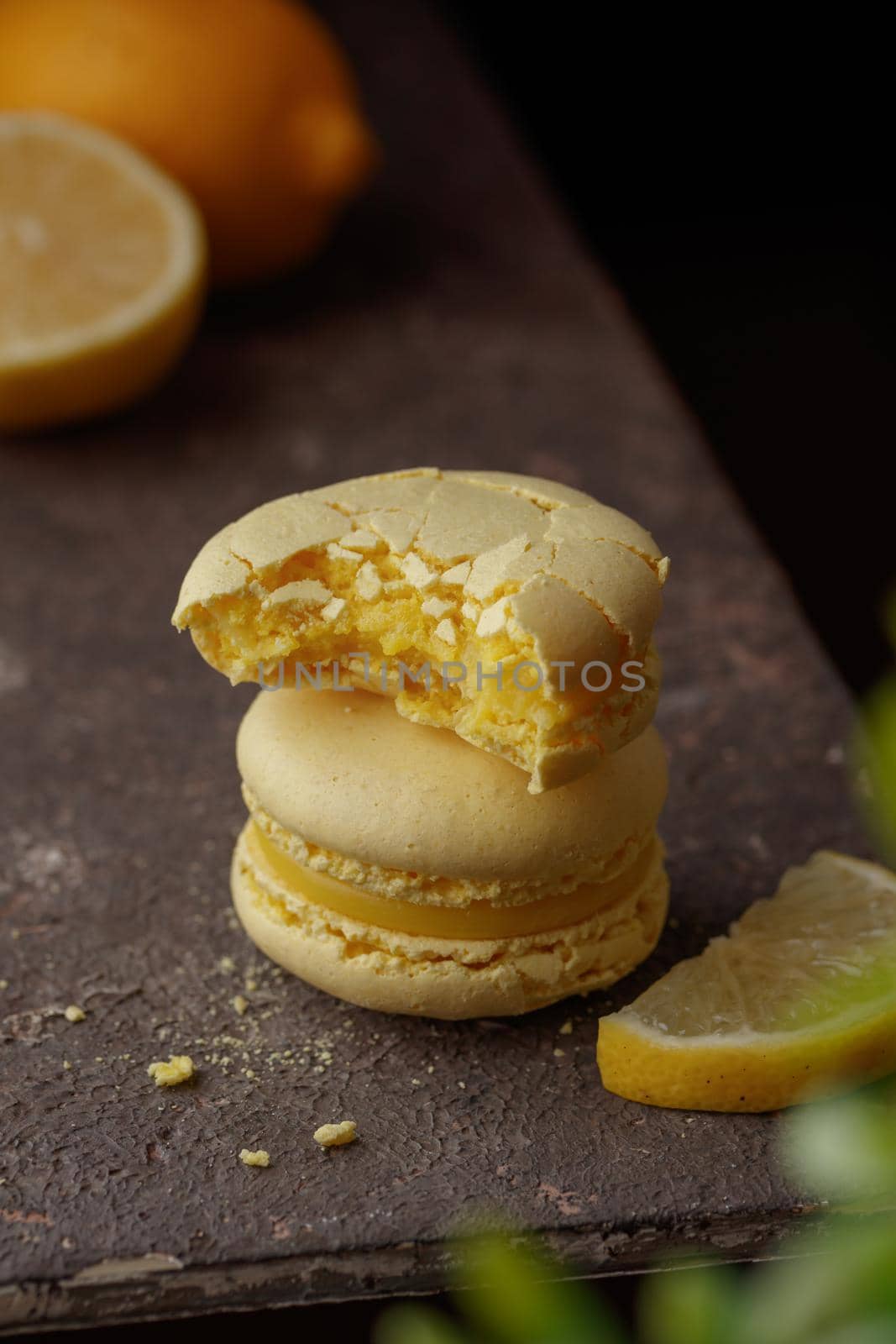 Lemon macaroons on a dark background macro