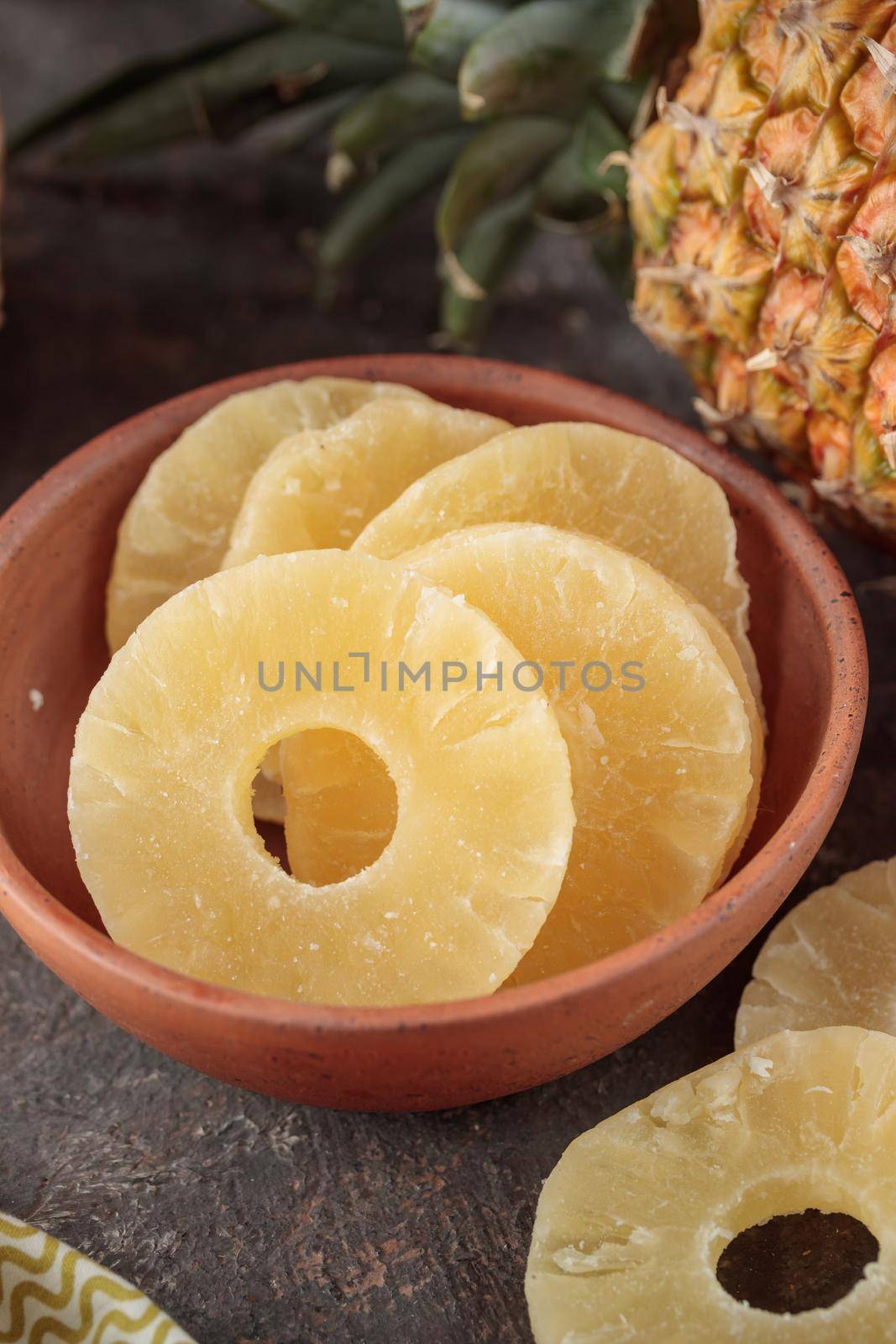 Dried Sweet Pineapple on a dark background