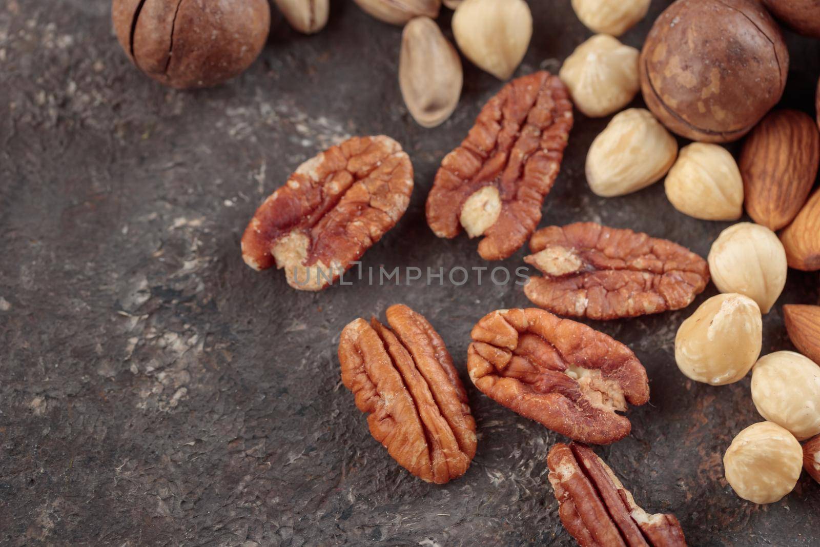 Assorted nuts macro on a dark background