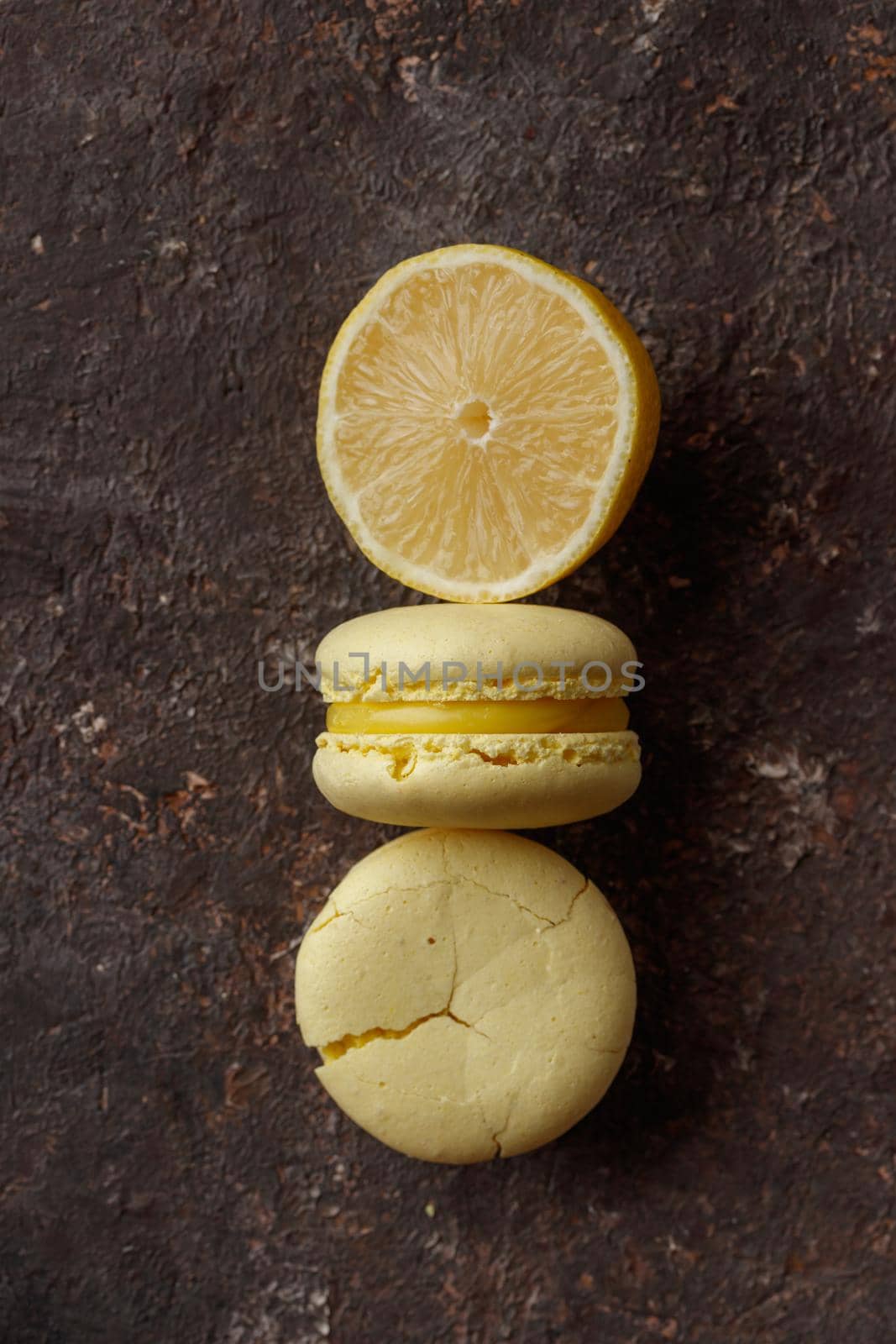 Lemon macaroons on a dark background macro