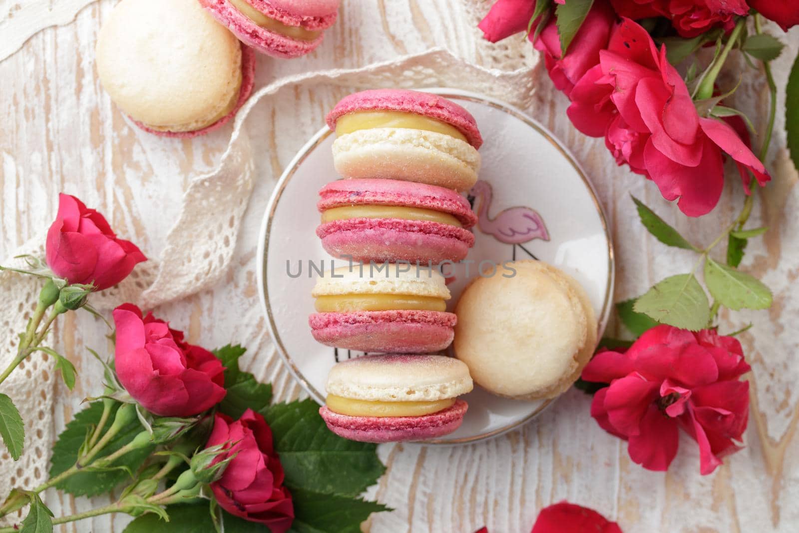 Colorful pink and yellow macaroons on the table