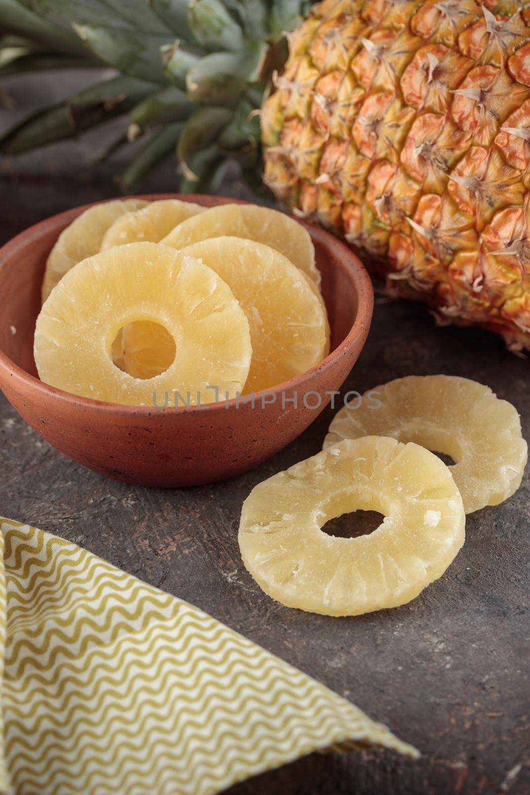Dried Sweet Pineapple on a dark background