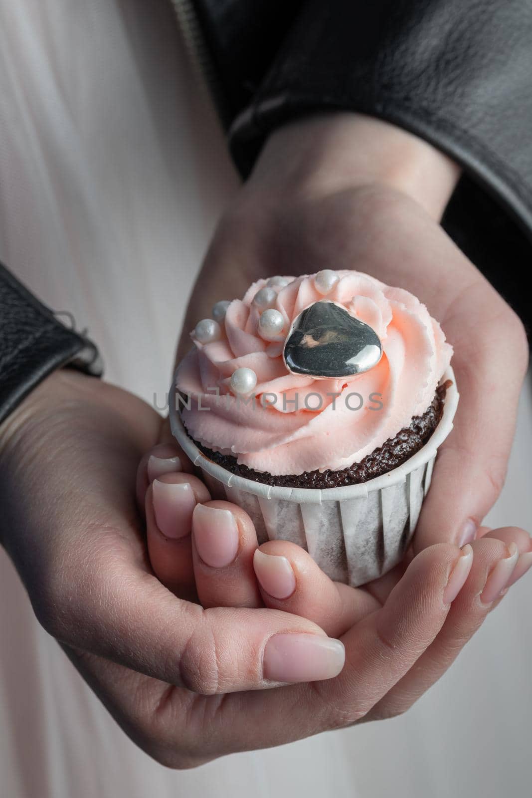 Grunge style cupcakes with black and pink cream vertical