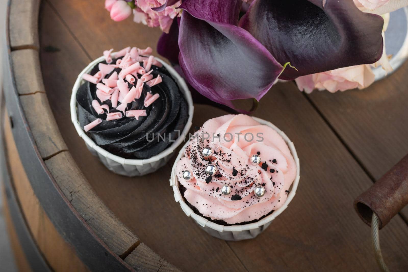 Grunge style cupcakes with black and pink cream Horizontal