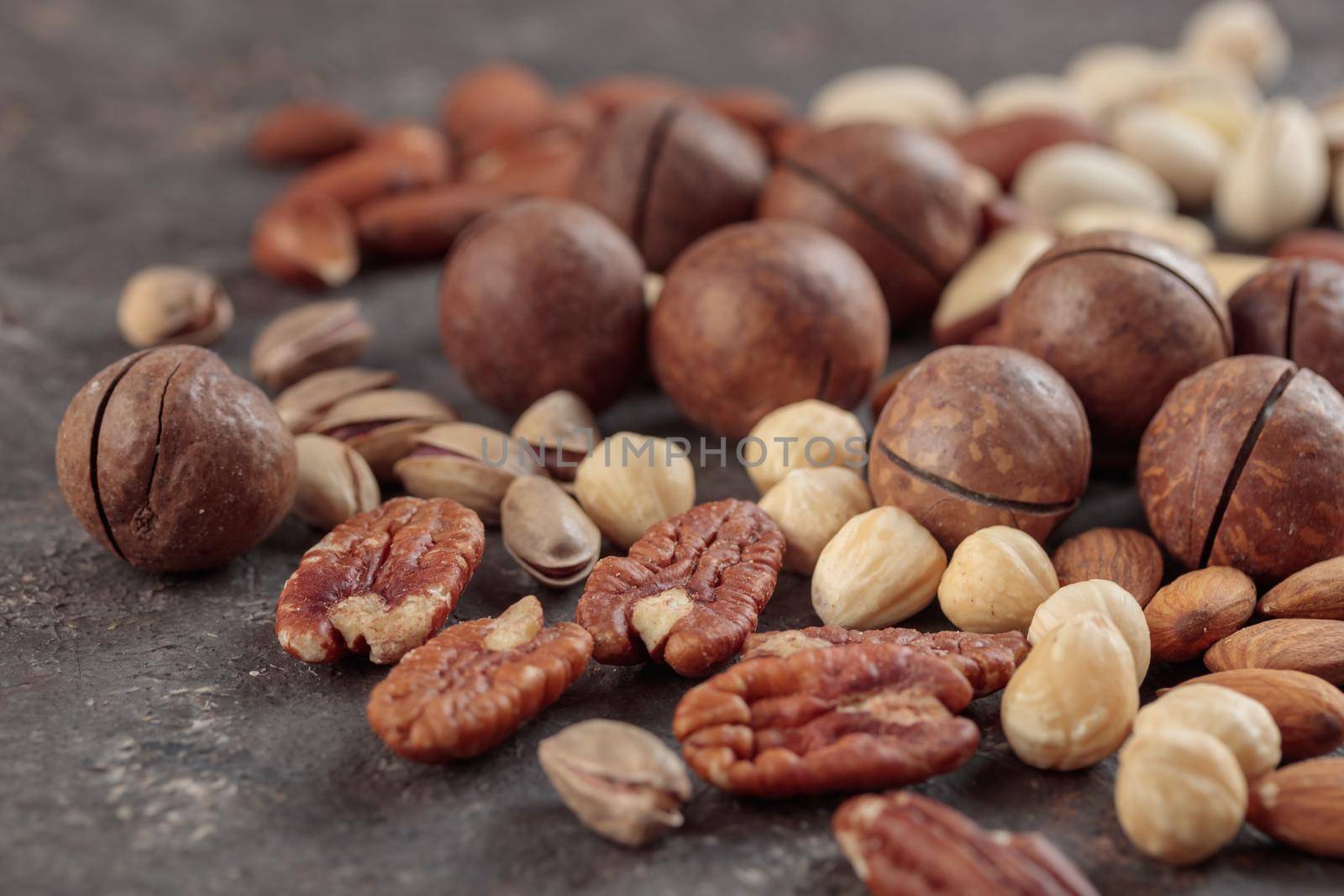 Assorted nuts macro on a dark background