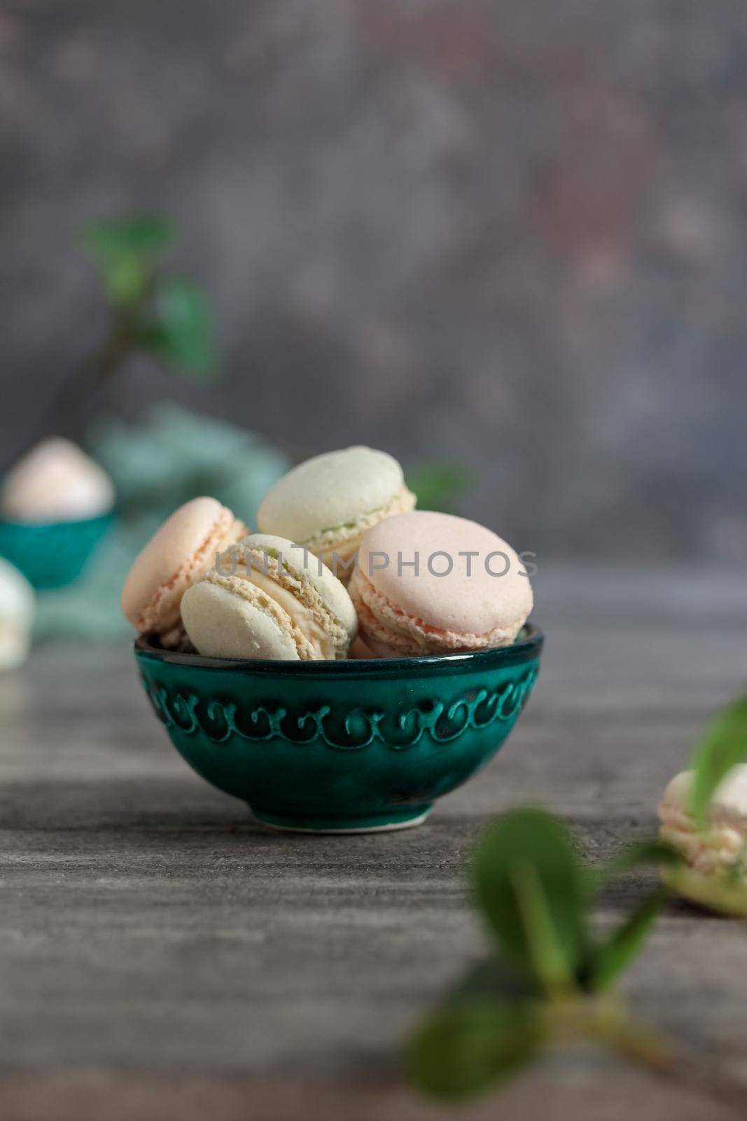 mini macaroons in a bowl on a table