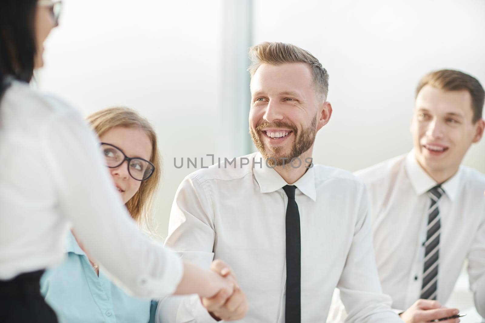 close up.businessman shaking hands with his business partner. concept of cooperation
