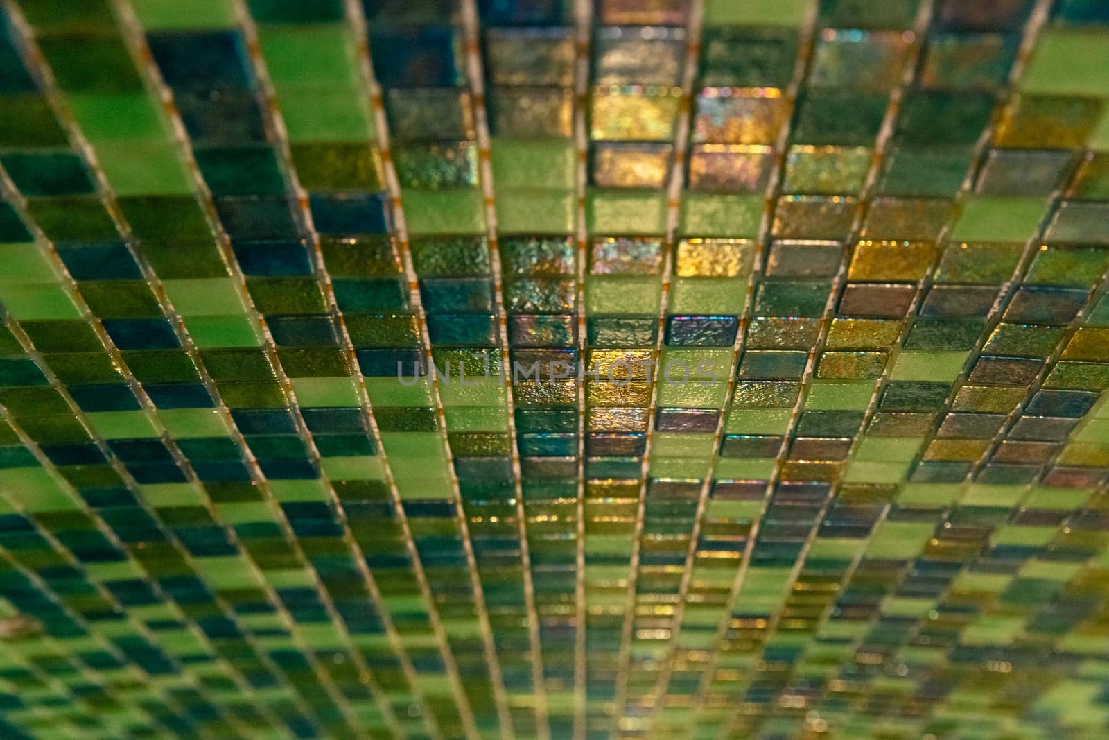 Close up modern green mosaic tiles on wall. Sauna room interior design with mosaic. Ceramic tiles mosaic. Close up.