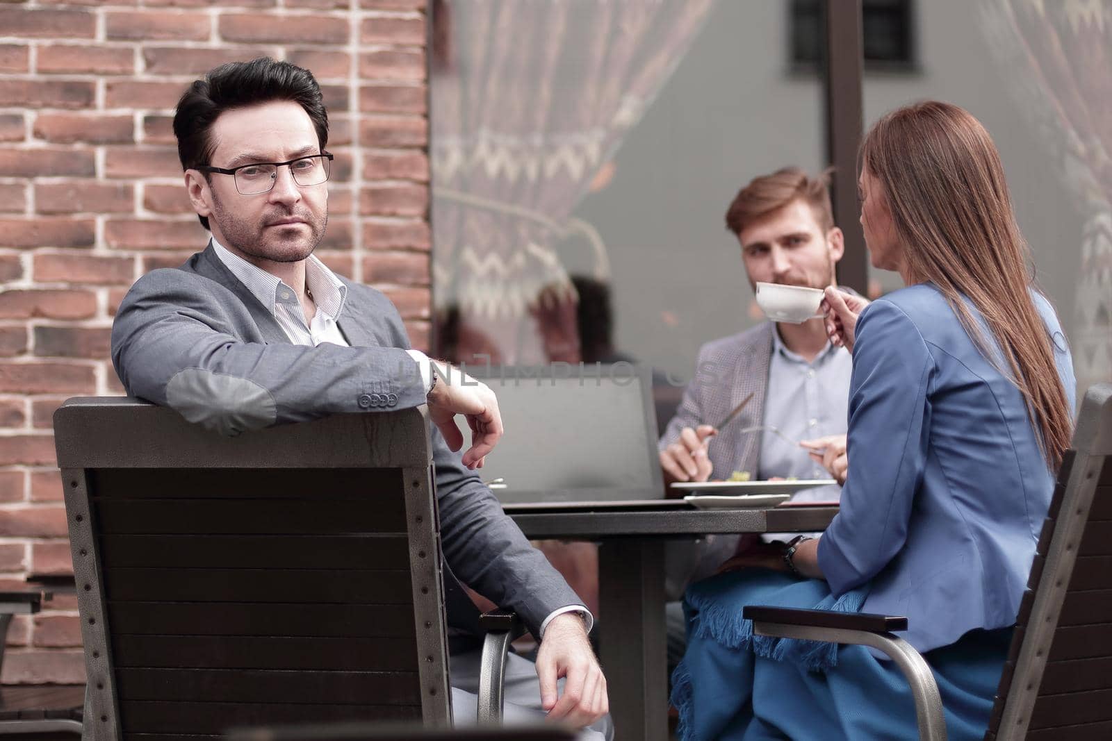 modern businessman on the background of the cafe by asdf