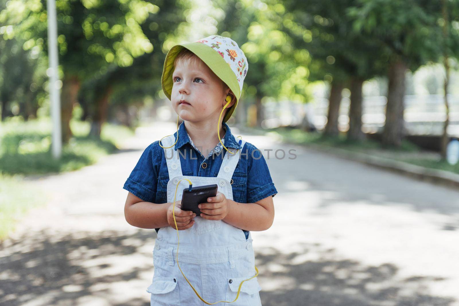 Cute boy posing for photo outdoors. Ukraine. Europe