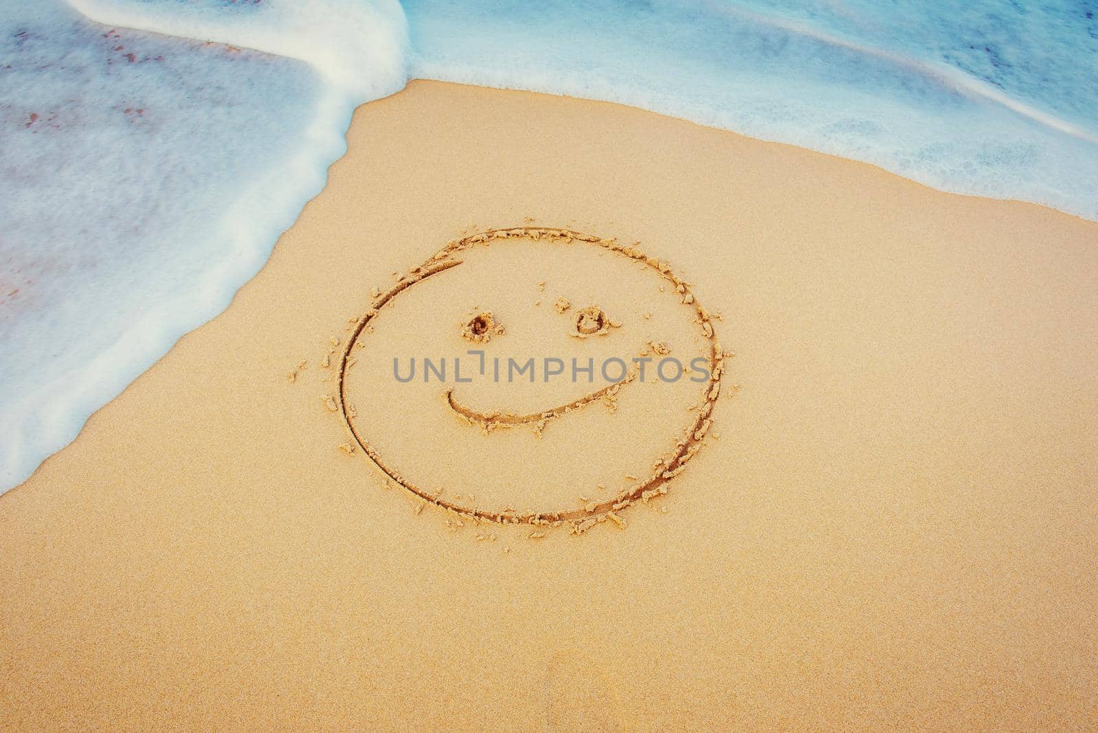 The drawings in the sand at the beach.