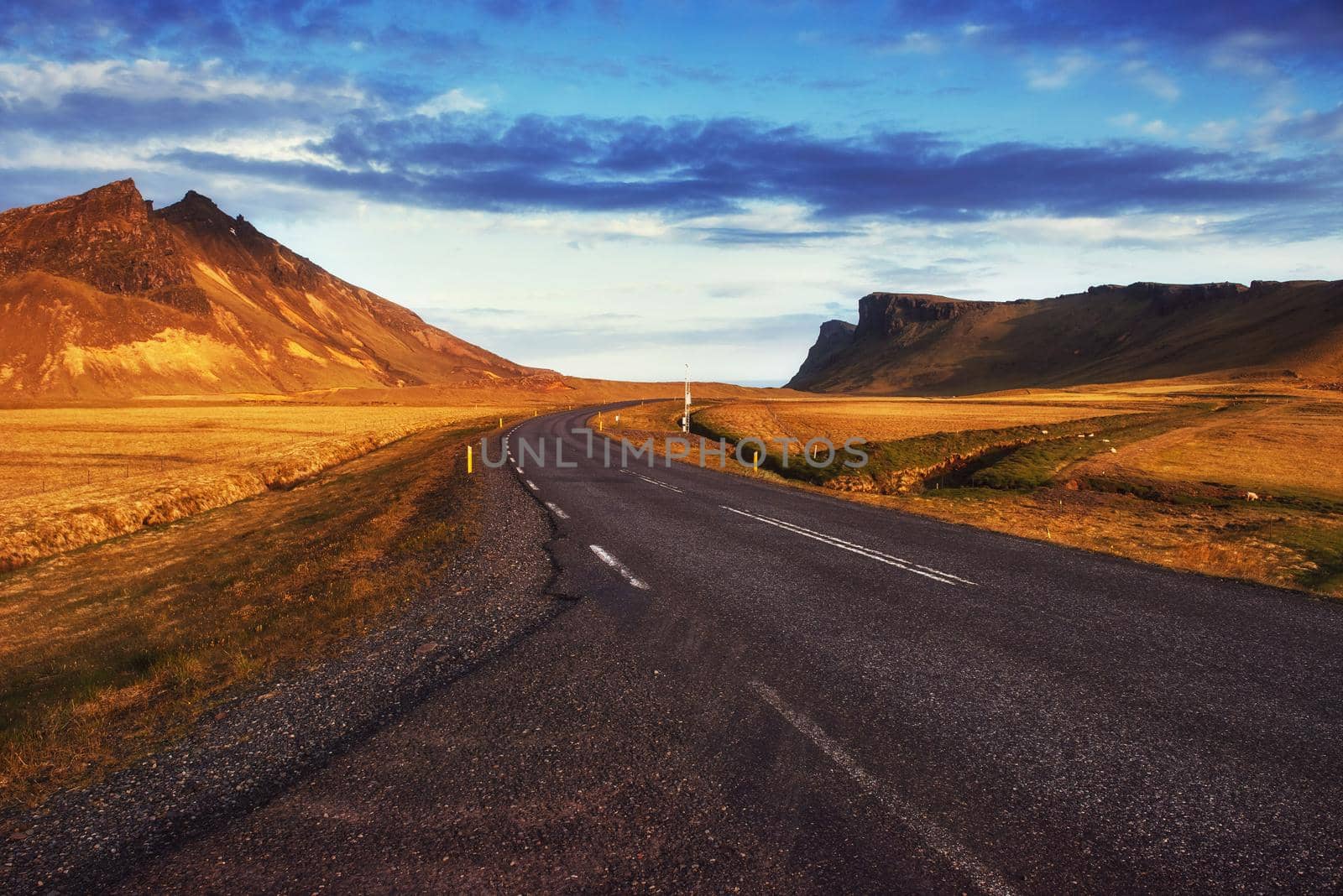 Asphalt road to the mountains. Beauty world. Iceland