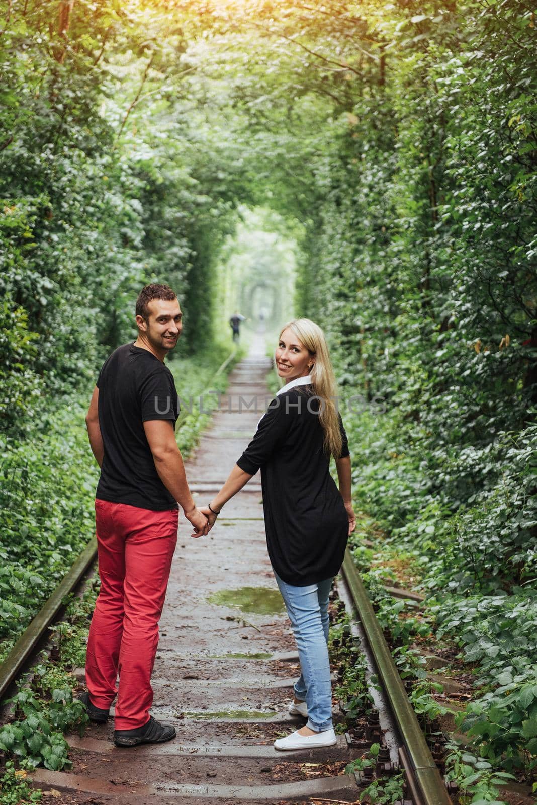 Loving couple on the iron road. Ukraine. Klevan