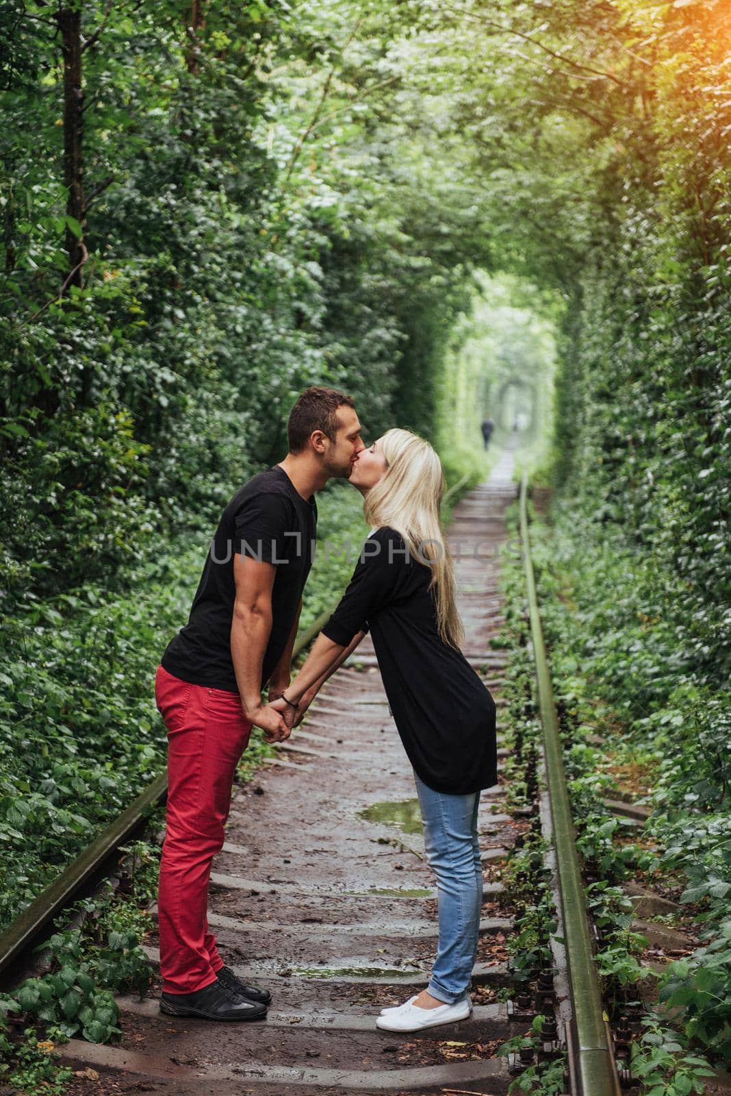 Loving couple on the iron road. Ukraine. Klevan