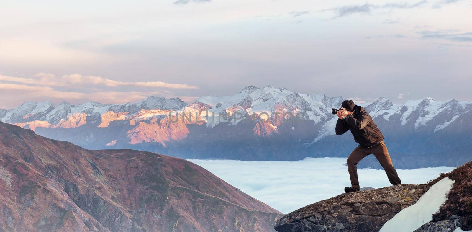 A tourist looks at the landscape. Beautiful sunset. Carpathians Ukraine Europe