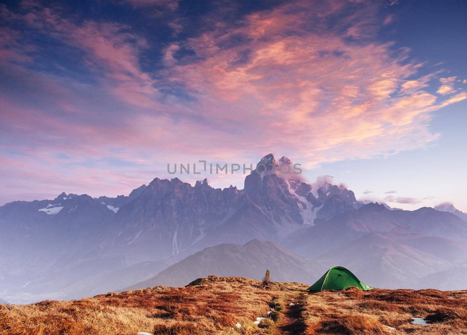 Tent green spread out on the pass Goulet. Georgia, Svaneti. Europe. Caucasus Mountains.