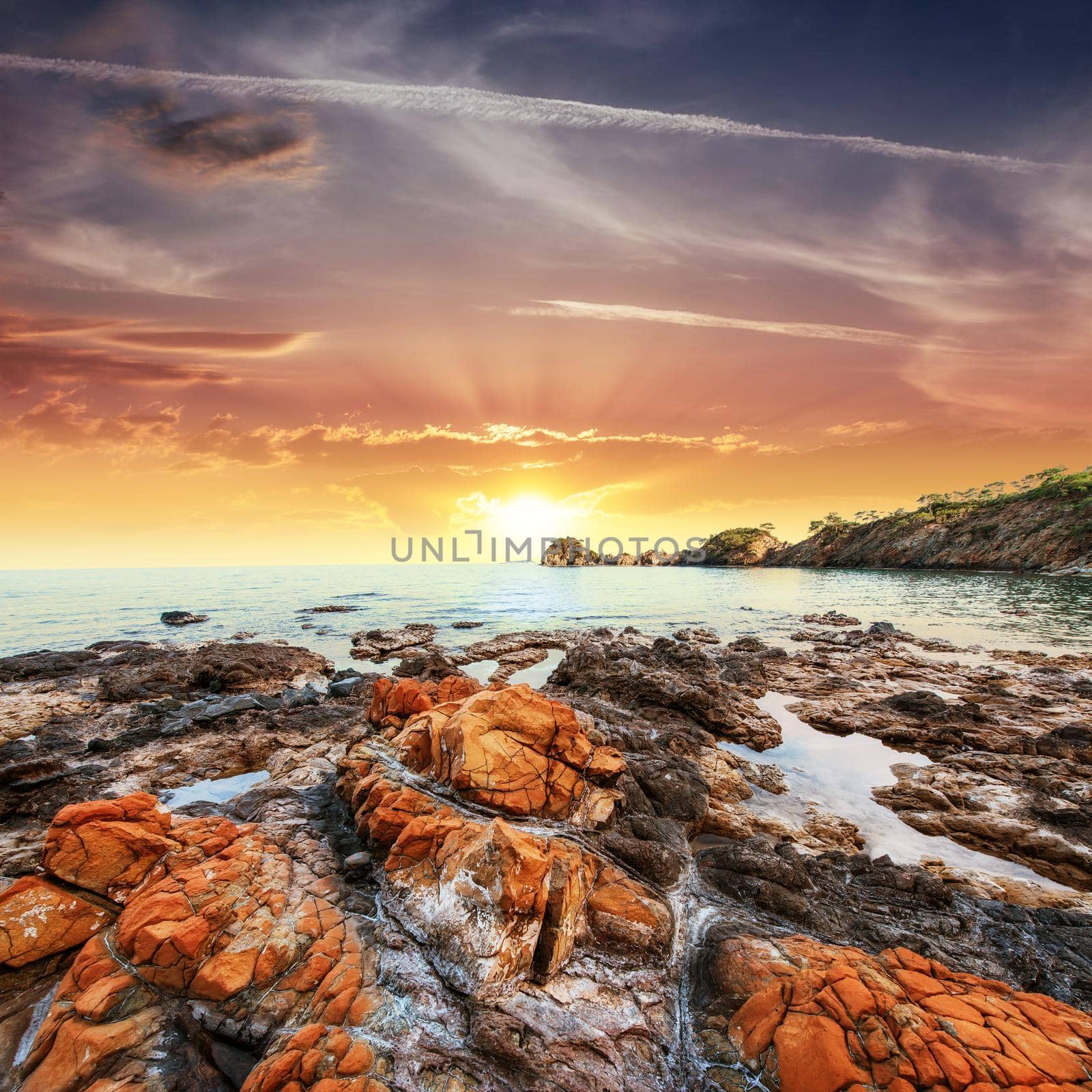 beautiful stones on the beach at sunset.