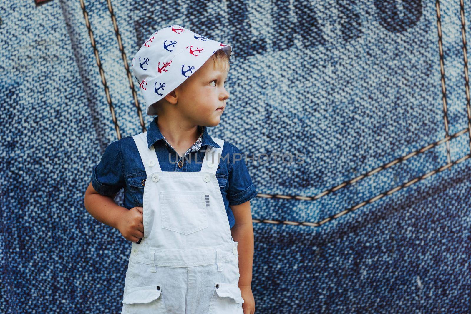 Cute boy posing for photo outdoors Ukraine. Europe.