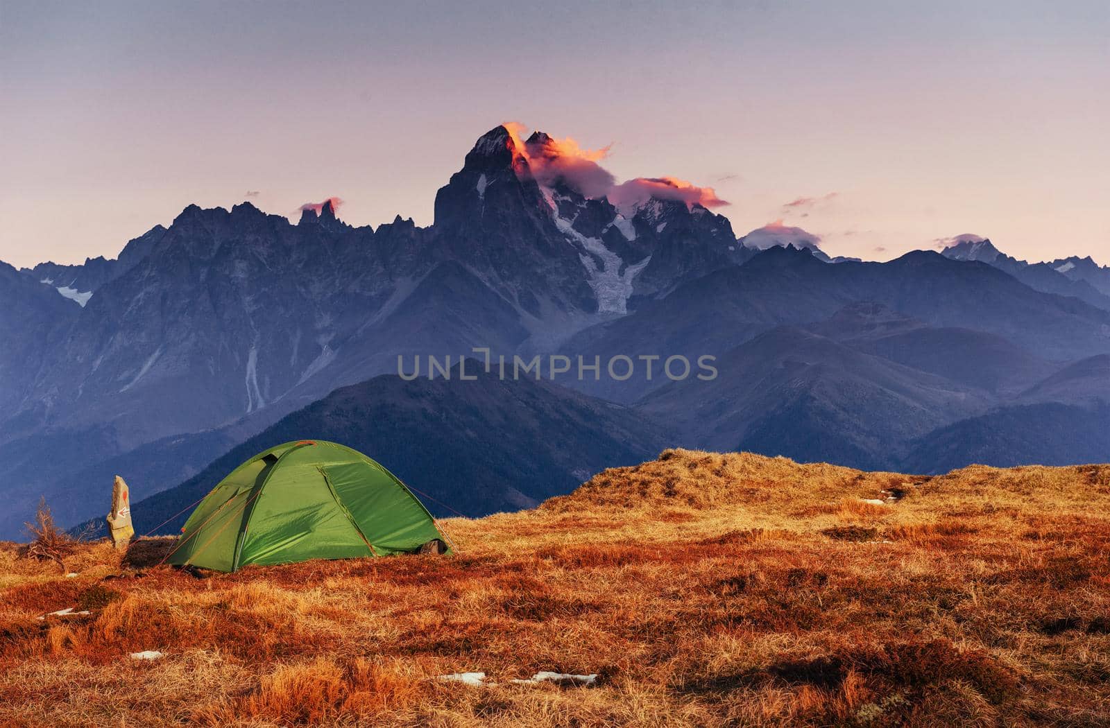 Tent green spread out on the pass Goulet. Georgia, Svaneti. Europe. Caucasus Mountains.
