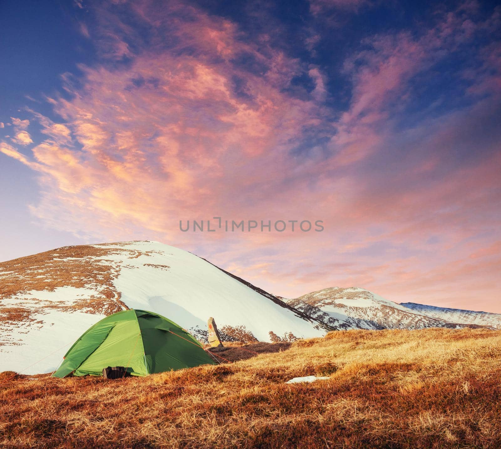 The tent is made up of green in the Carpathians. Spring mountain landscape. Ukraine. Europe.