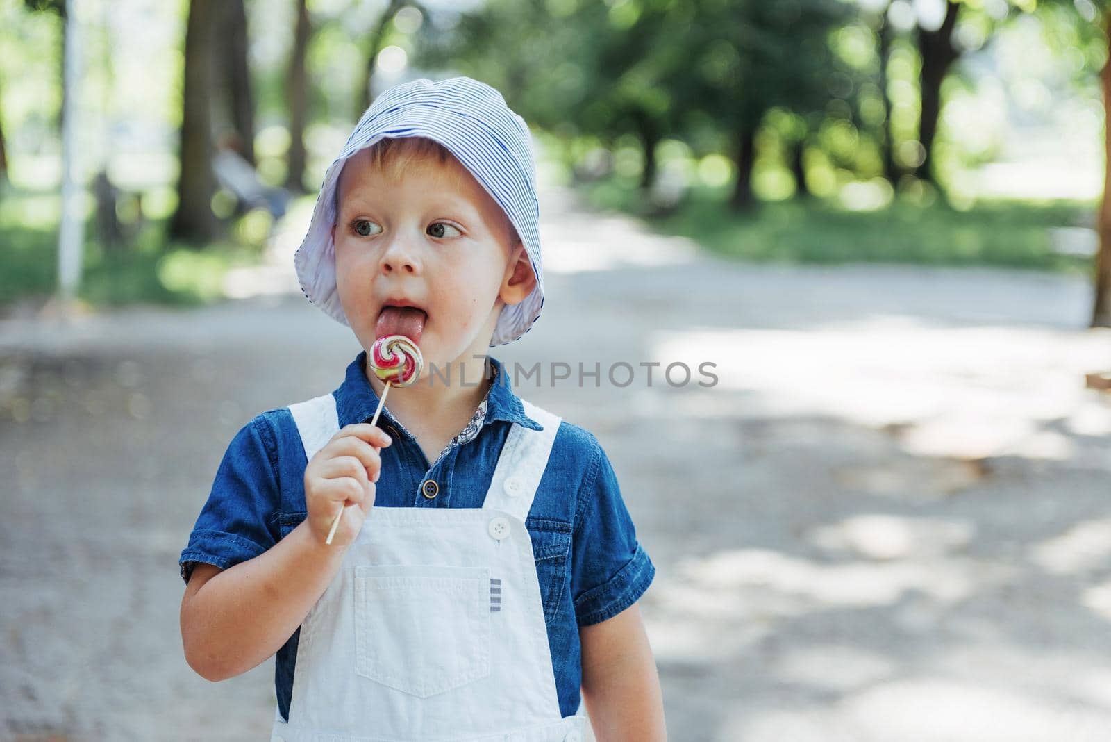 young boy with colorful lollipop. Ukraine. Europe