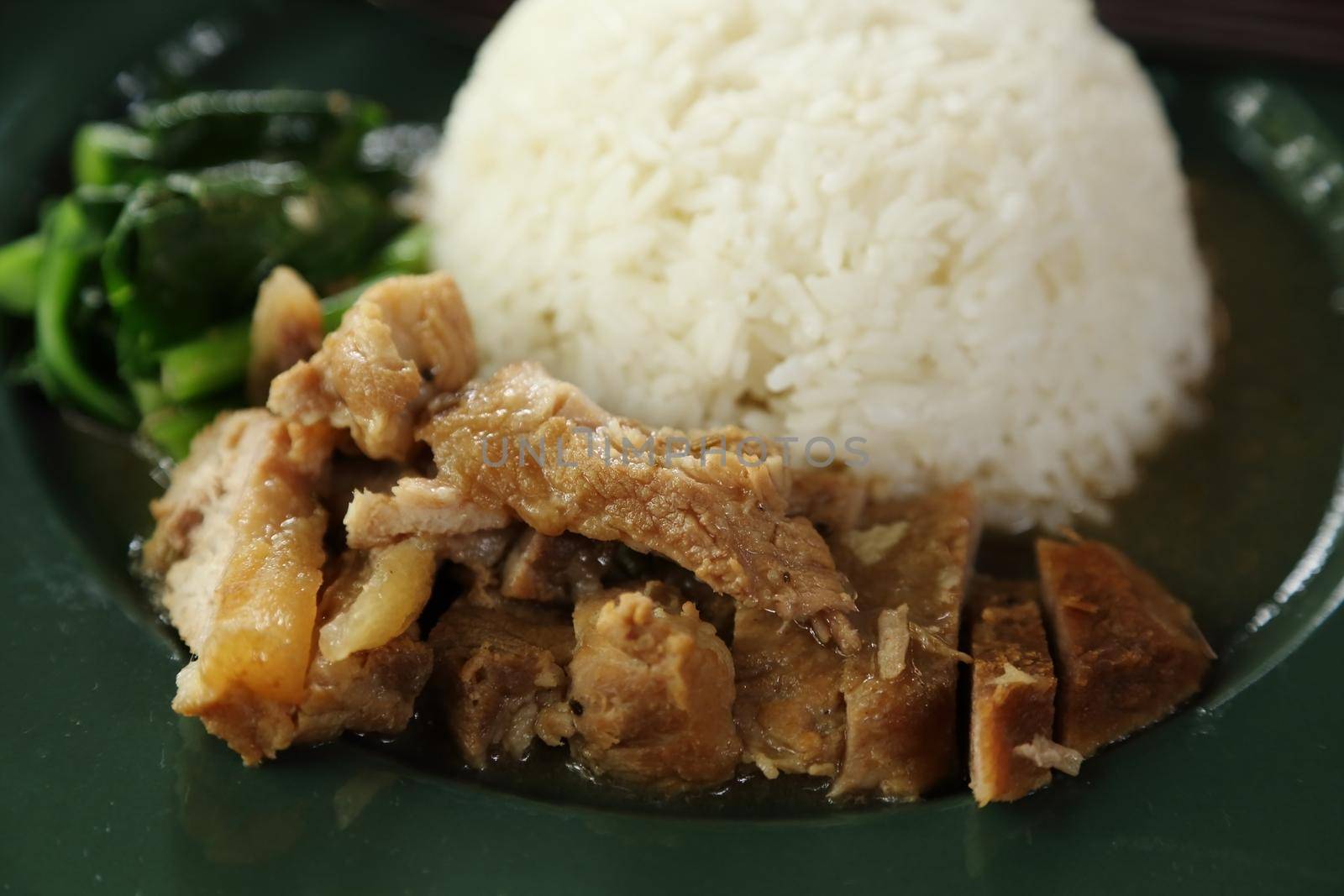 Fried pork with rice on plate by geargodz