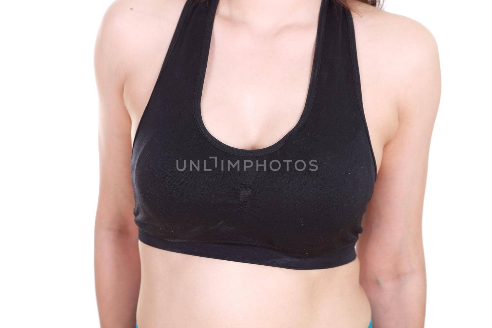 close up of a woman's chest in her sports bra.