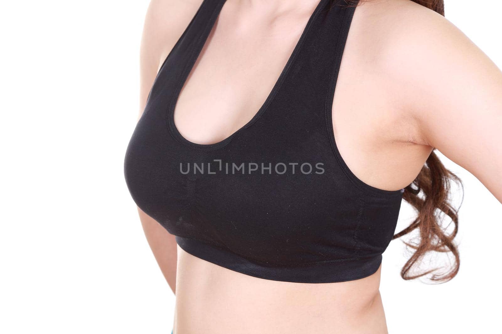 close up of a woman's chest in her sports bra.