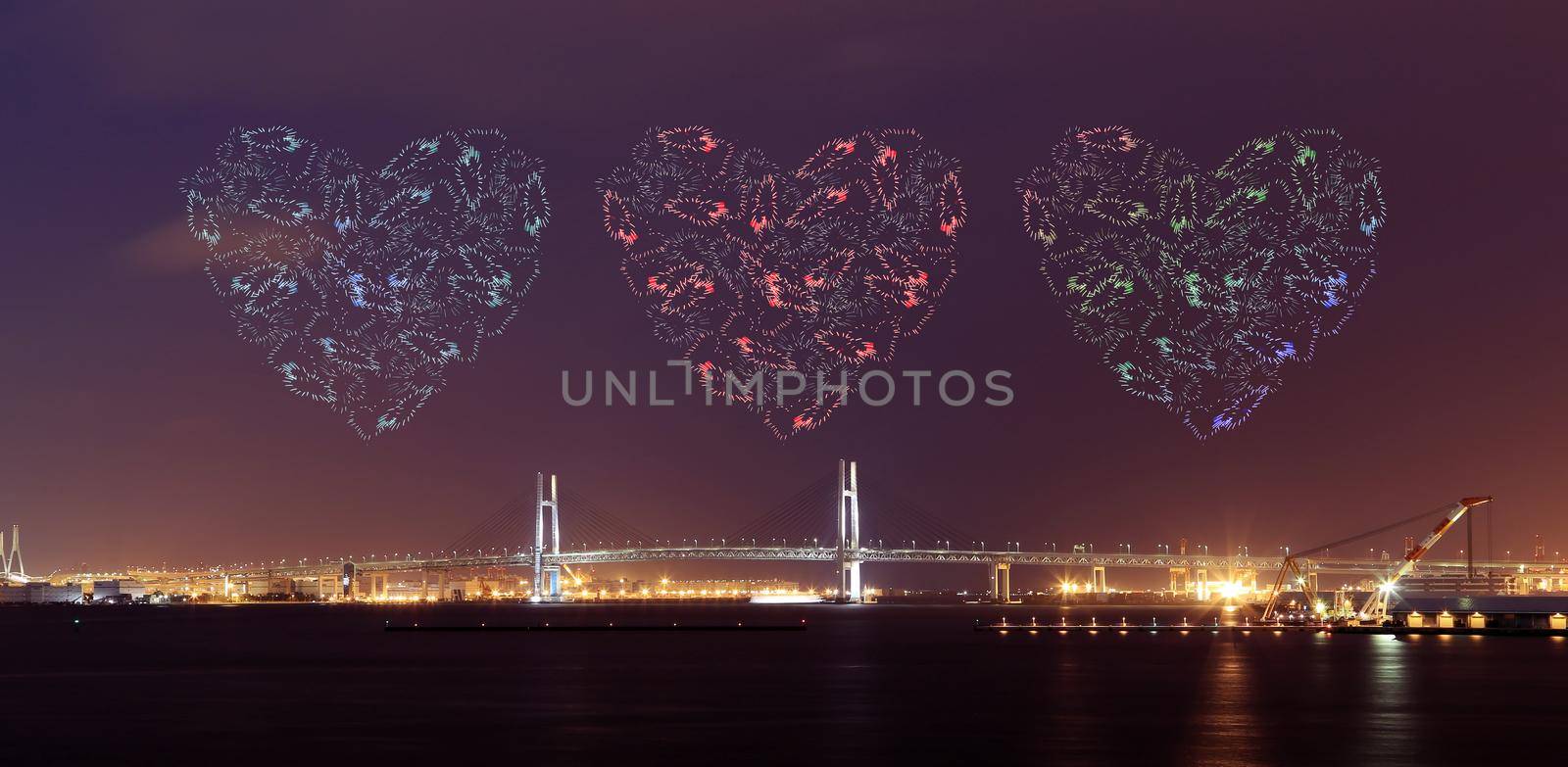heart Fireworks celebrating over Yokohama Bay Bridge at night, Japan
