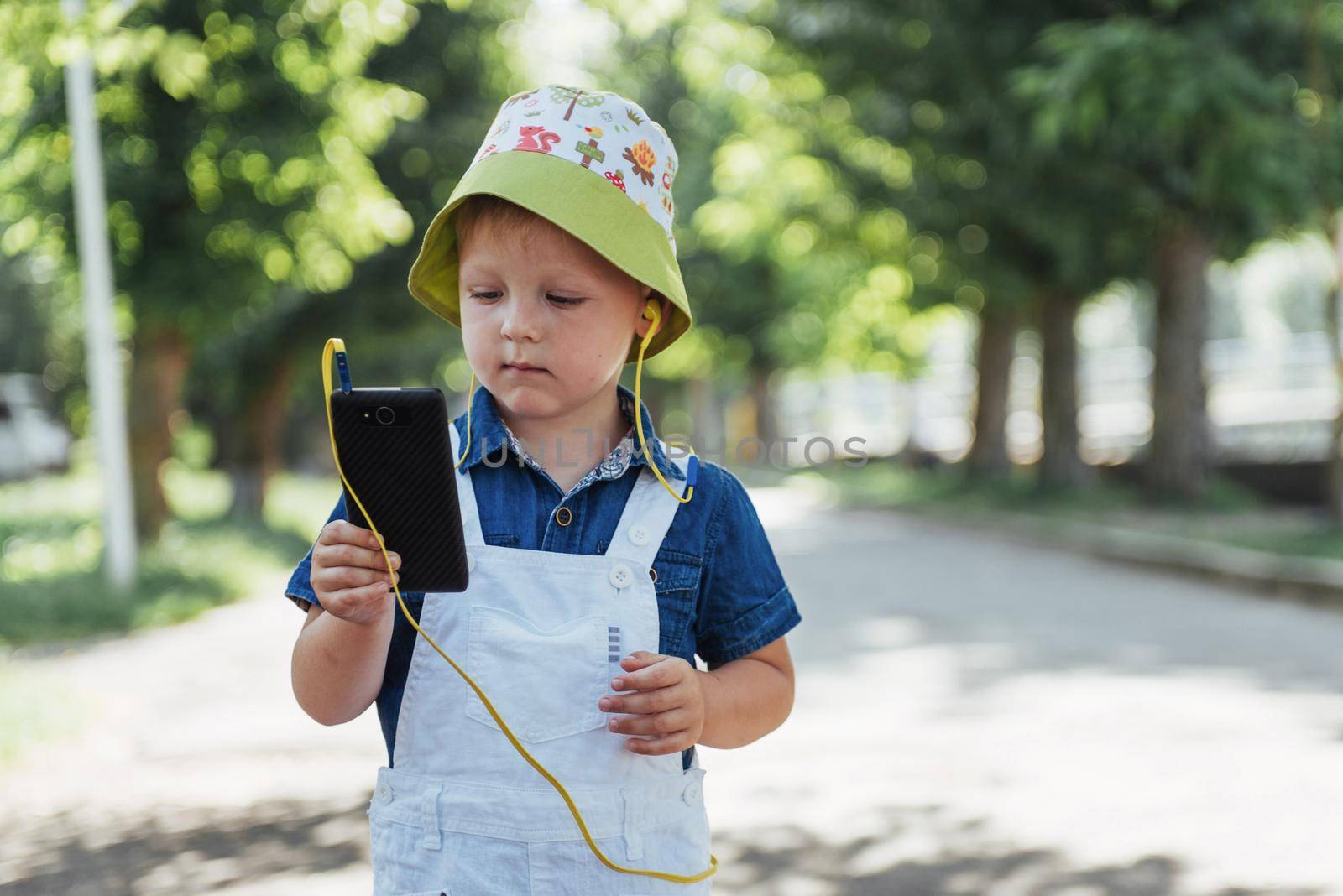 Cute boy posing for photo outdoors. Ukraine. Europe