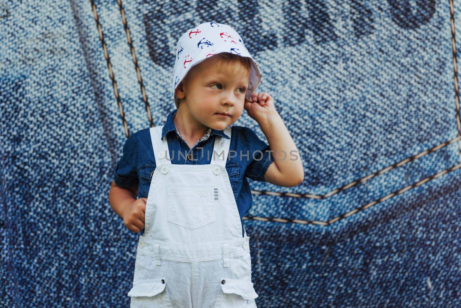 Cute boy posing for photo outdoors Ukraine. Europe.