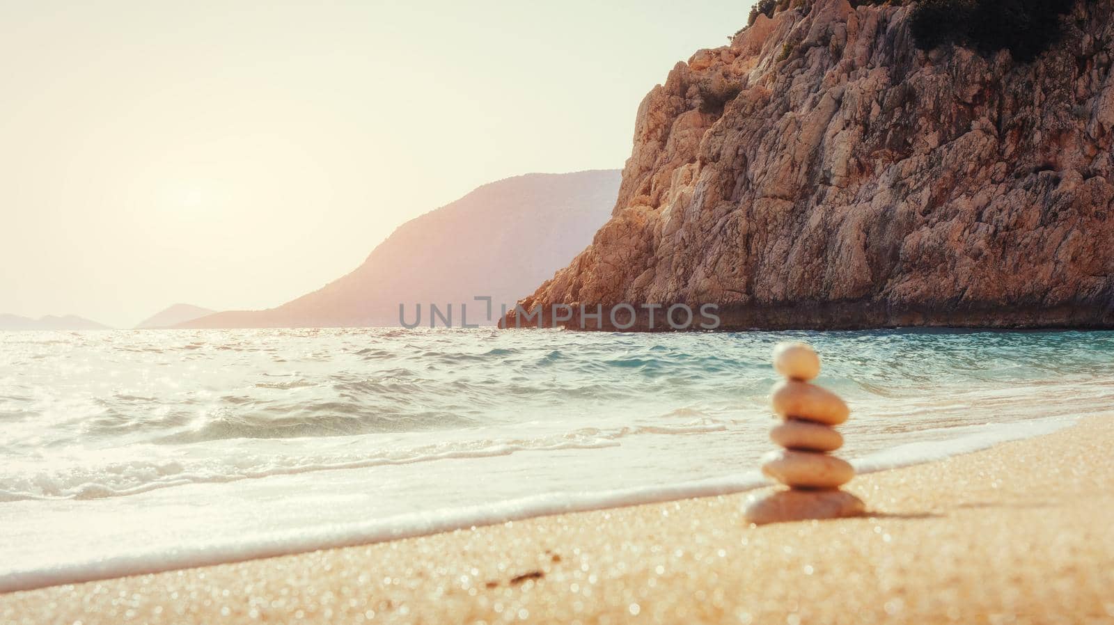 Scenic view of sandy beach and surf waves on the shore