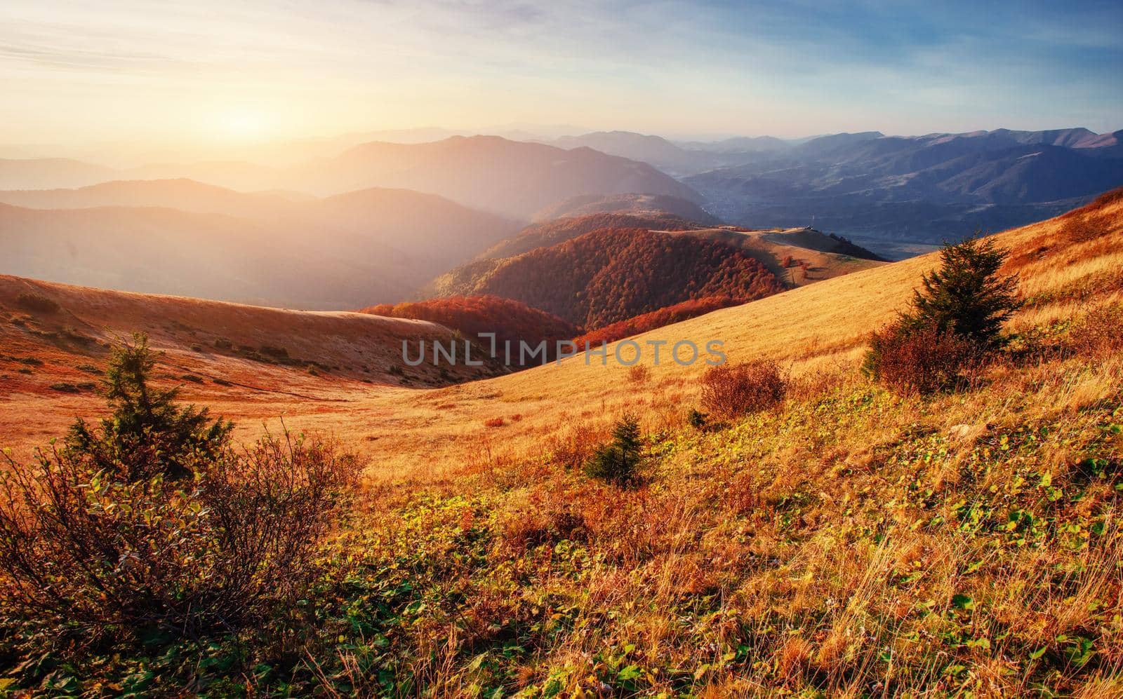 mountain range in the Carpathian Mountains in the autumn season. Fantastic sunset. Ukraine, Europe.
